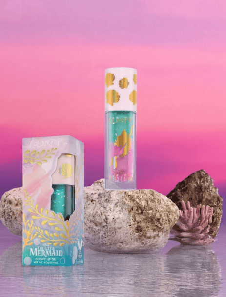 Disney Mermaid lip gloss set with shimmering colors and ocean-inspired packaging.