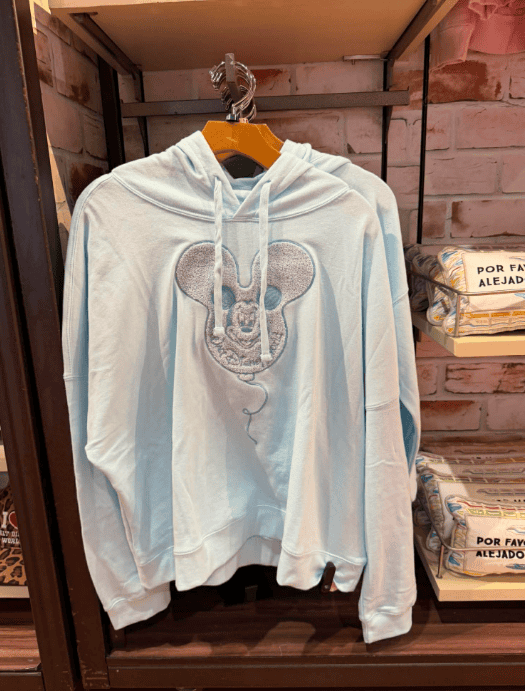 White Mickey Mouse hoodie with embroidered character design, casual Disney fashion.