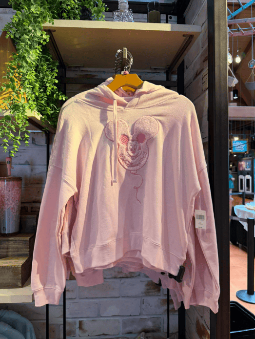 Pink Mickey Mouse hoodie with embroidered face, casual style, perfect for Disney fans.