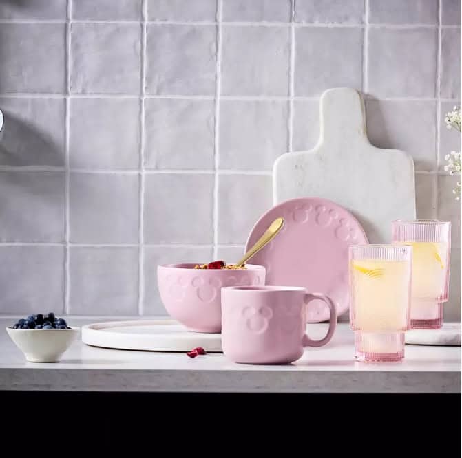 Bright pink and blue Disney-themed dinnerware for magical home dining experiences.