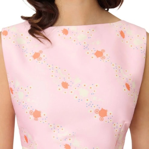 Disney fashion dress with pink base and whimsical character pattern.