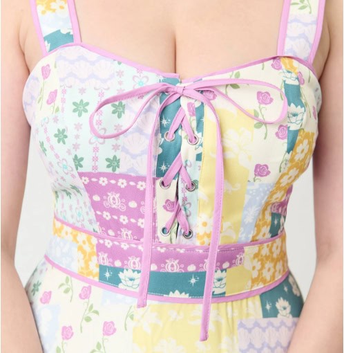 Floral patchwork dress with lace-up front, pastel colors, and feminine style.