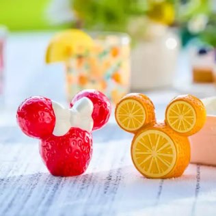 Vibrant Mickey Mouse-inspired fruit treats featuring strawberries and citrus slices.
