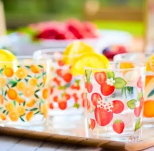 Colorful fruit-themed glasses perfect for summer beverages and outdoor gatherings.
