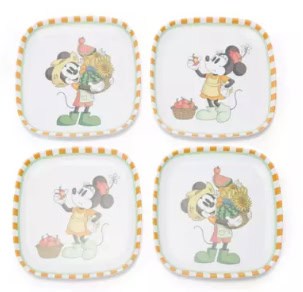 Mickey Mouse and friends themed dessert plates with colorful Disney character designs.