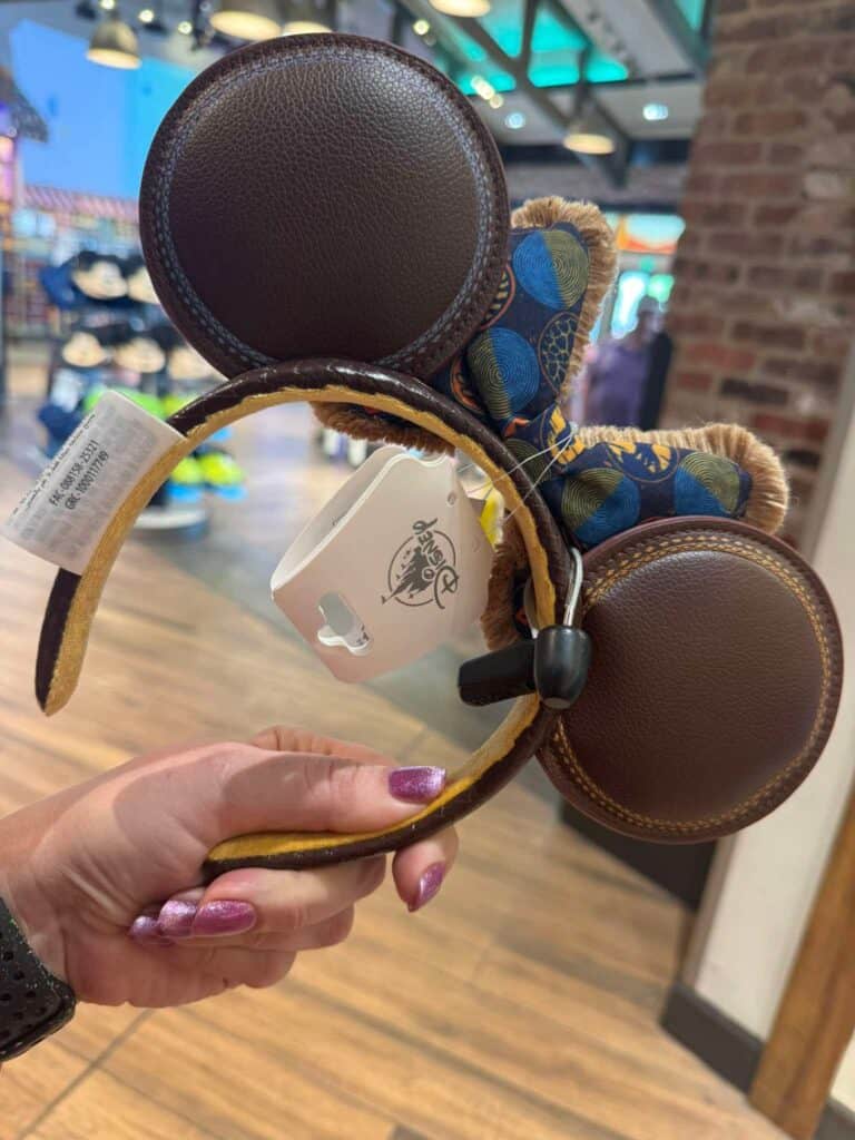 Mickey Mouse ears headband with plush bow, perfect Disney fashion accessory for fans.