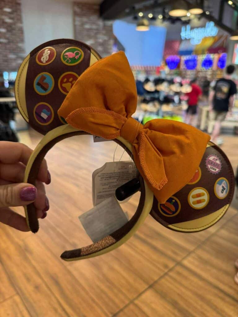 Minnie Mouse themed headband with orange bow, perfect for Disney fans and kids.