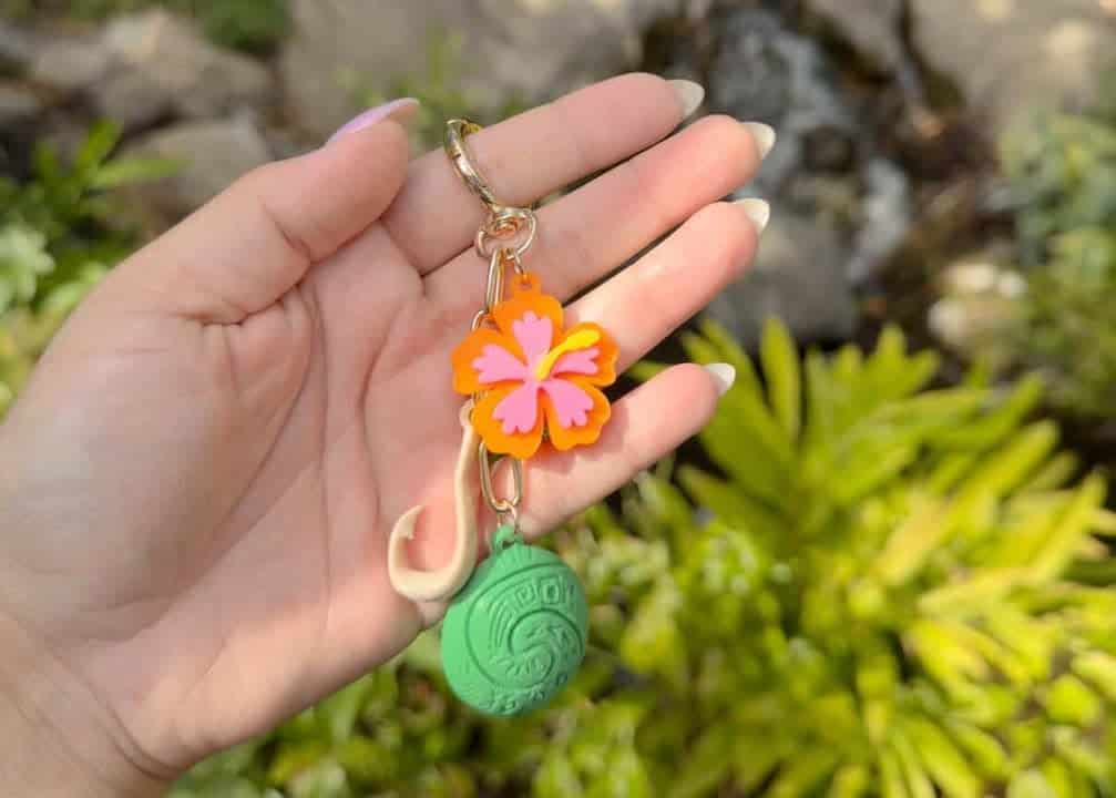Disney tropical flower and ball keychain accessory.