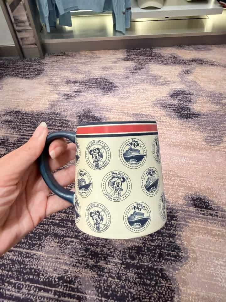 Vintage Mickey Mouse themed ceramic mug with retro Disney logo pattern.