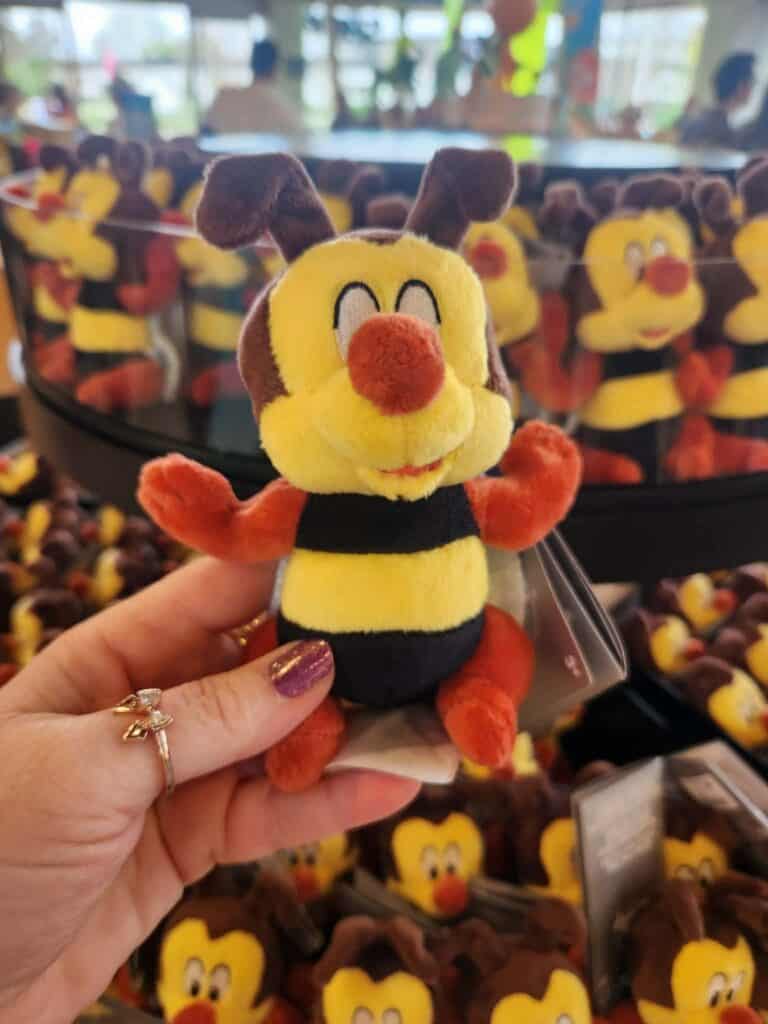 Soft Pluto plush toy from Disney with bright colors and detailed features.