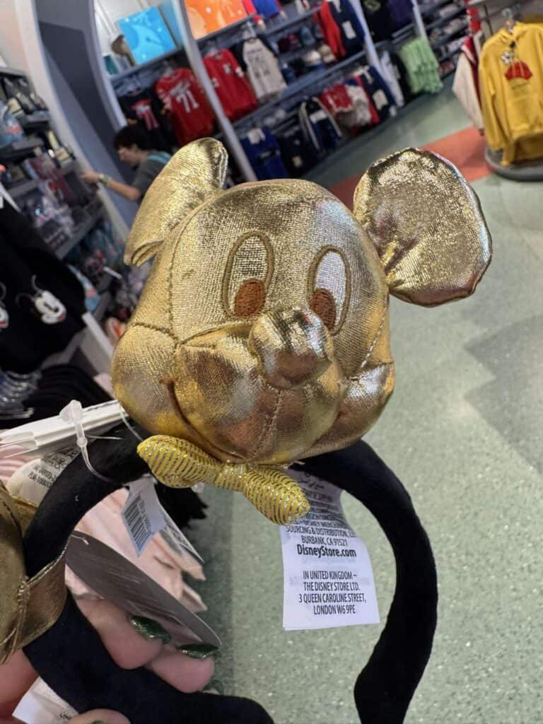 Gold Mickey Mouse headband with ears and face, perfect Disney costume accessory.