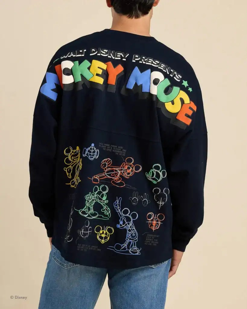 Mickey Mouse graphic sweatshirt with colorful logo and sketches on the back.