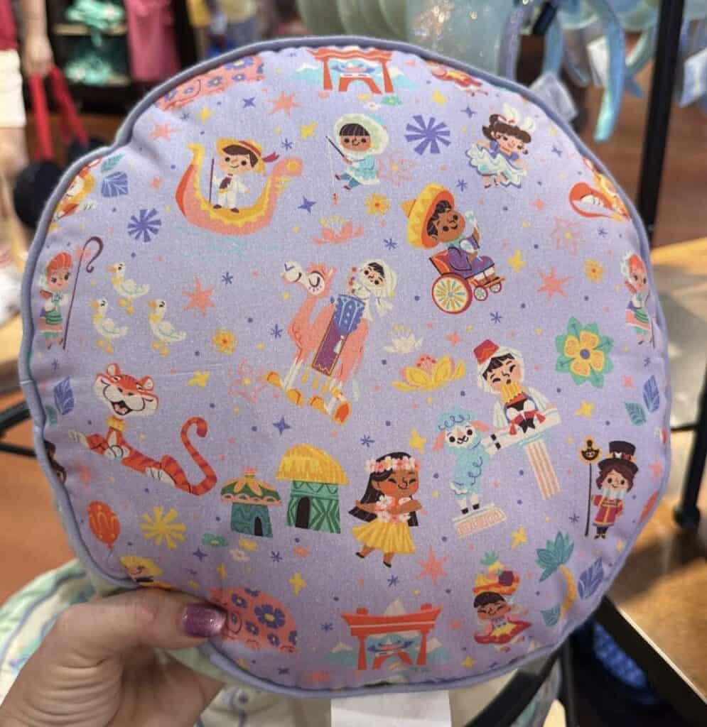 Colorful Disney princess-themed backpack with various characters and motifs.