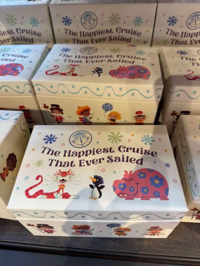 Disney cruise themed gift box with colorful characters and ocean motifs.