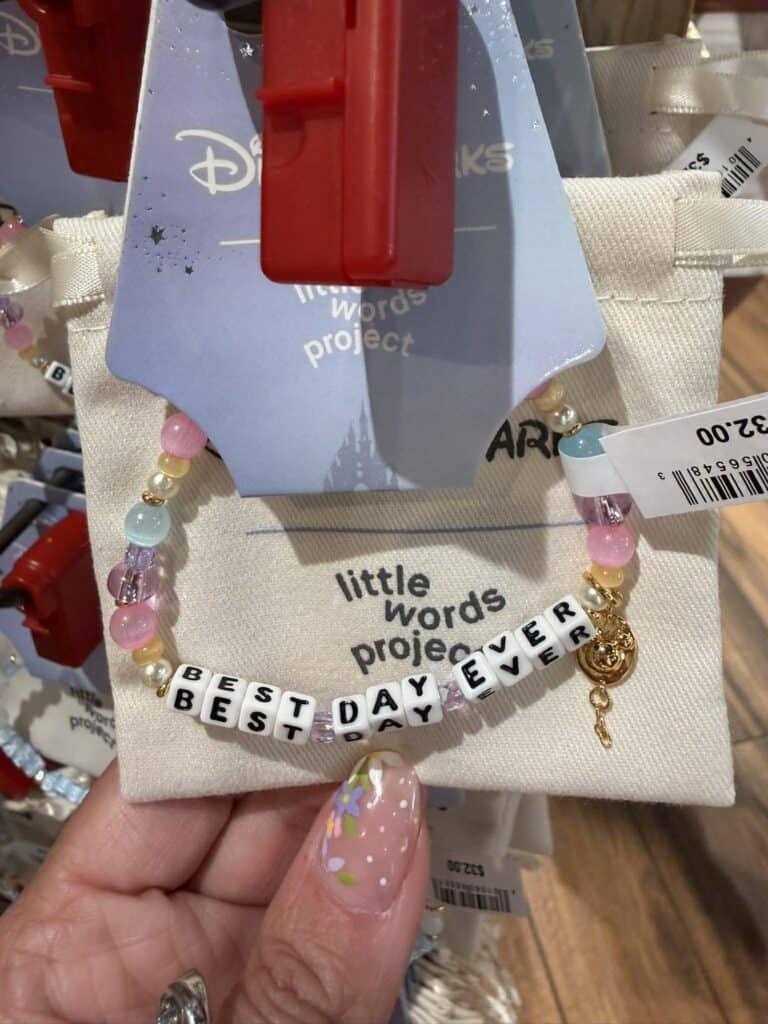 Disney Little Words Project bracelet with "Best Day Ever" beads on display.