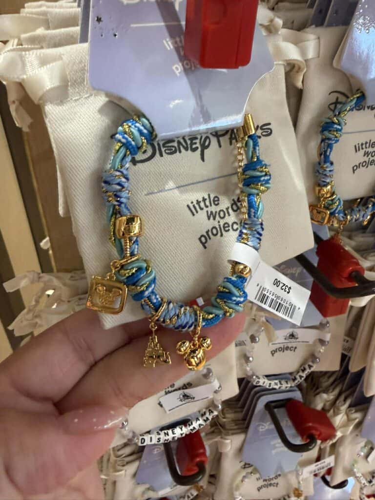 Cute Disney-themed bracelet with charms and blue accents.