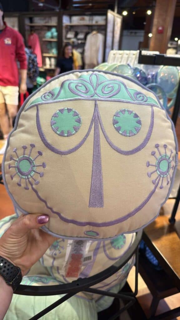 Backpack featuring a whimsical, artistic face design inspired by Disney characters. Perfect for fans.