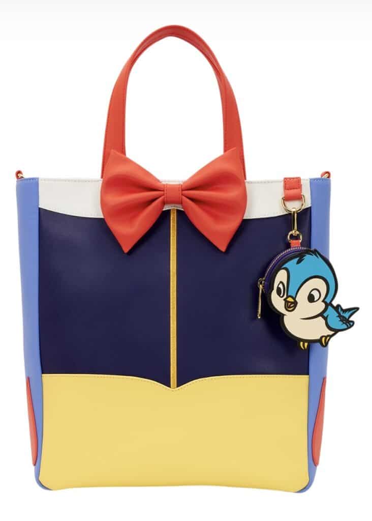 Disney tote bag with penguin charm and bow detail.