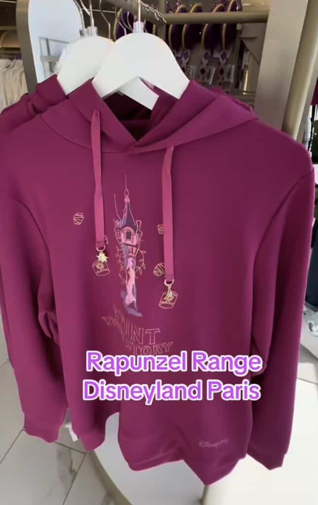 Pink Rapunzel hoodie with lantern design, Disneyland Paris merchandise.