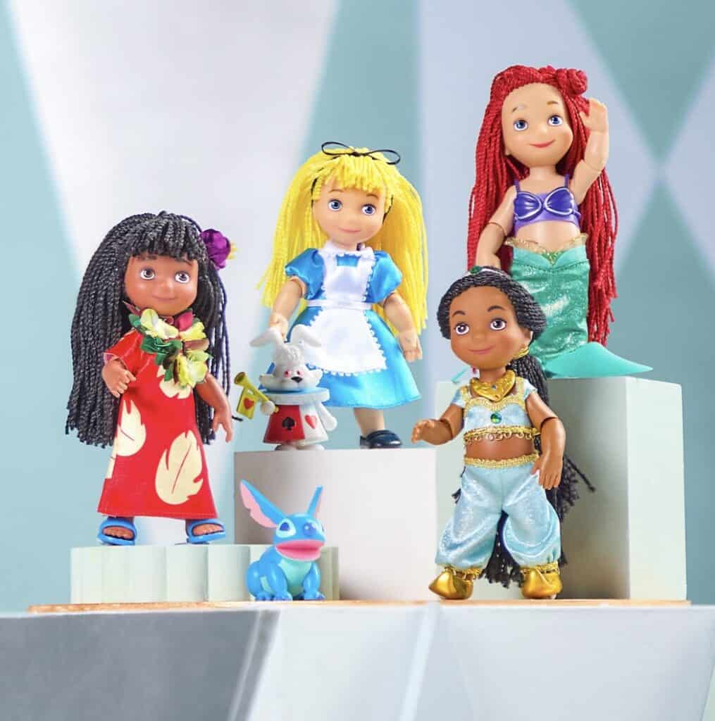 Disney princess dolls on display with vibrant costumes and detailed features.