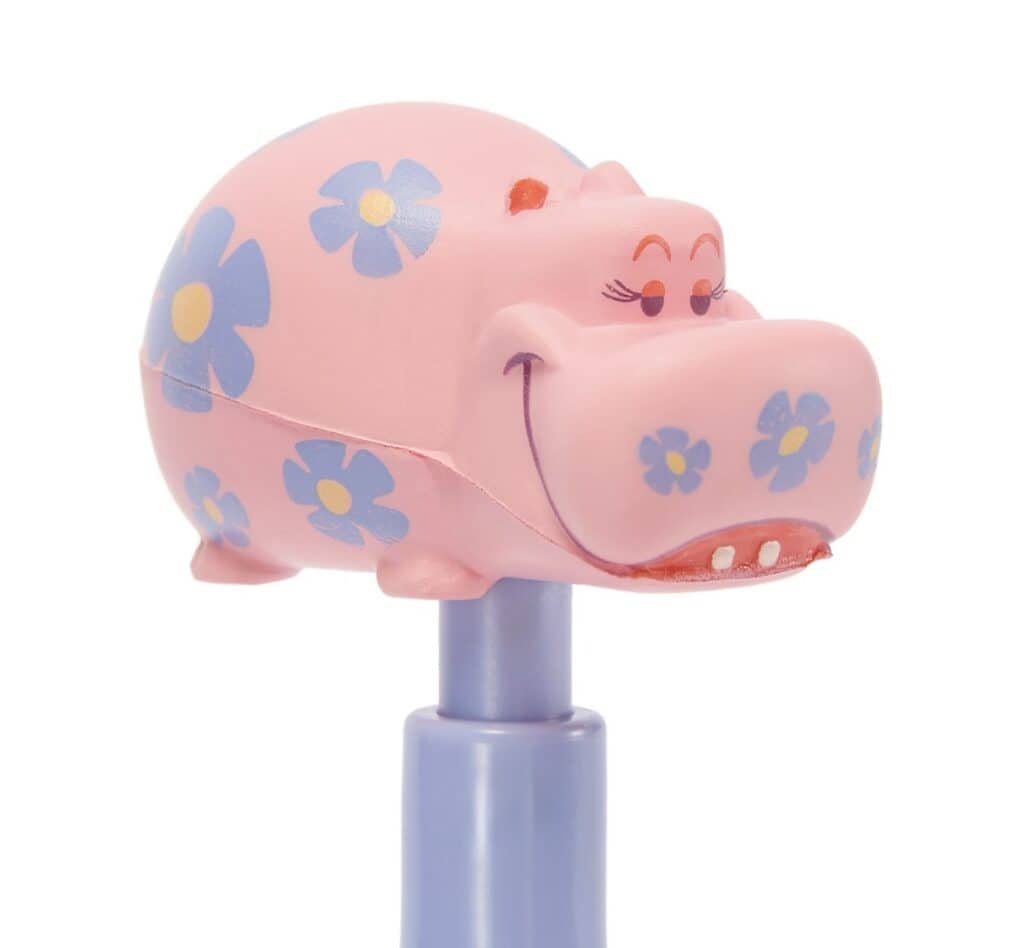 Cute pink hippopotamus toy with blue flower patterns, smiling face, and mounted on a blue stick.