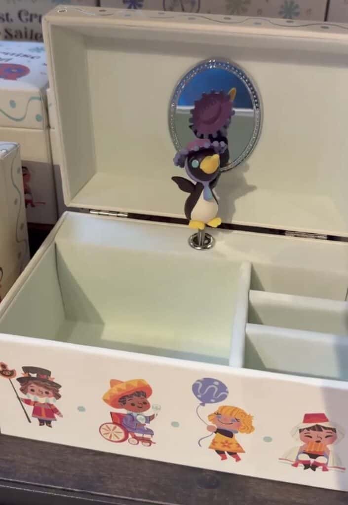 Disney-themed vanity with mirror and plush character figurine.