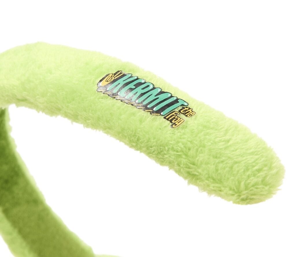 Headband featuring a fuzzy green fabric and "The Acromant" logo for Disney fans.