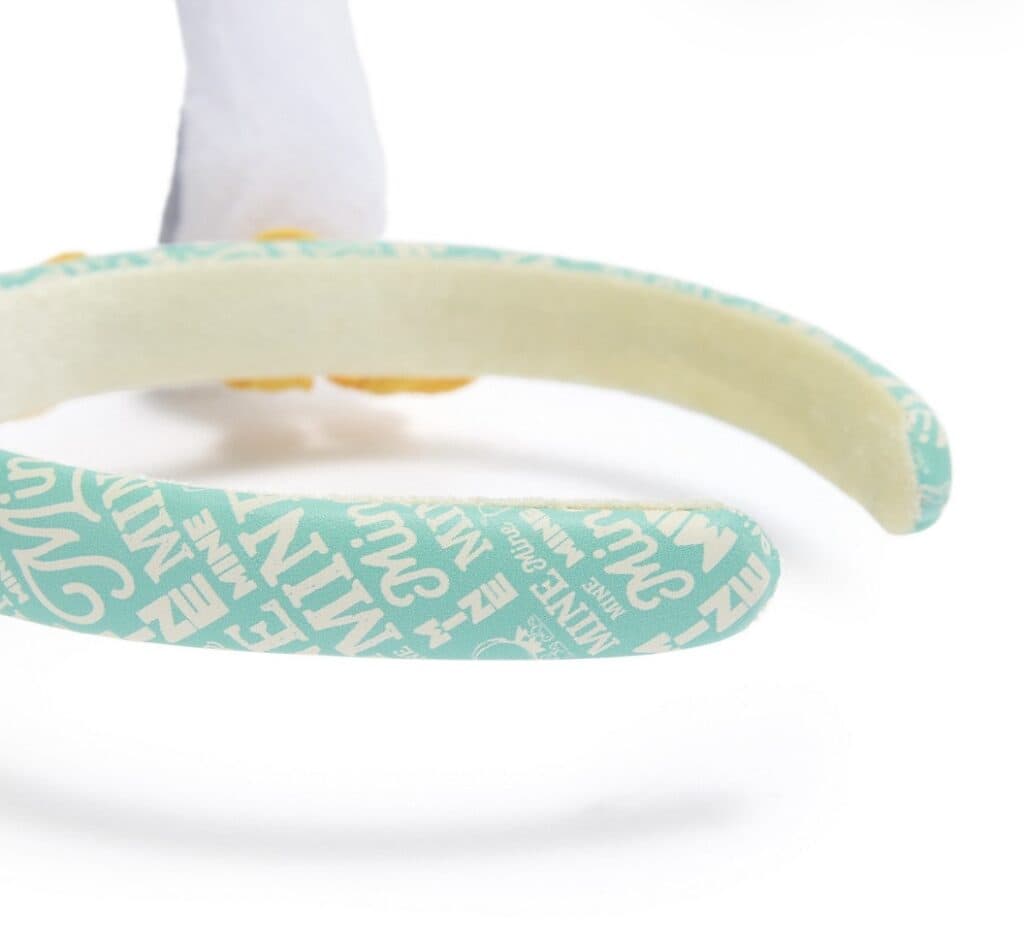 Cute Minnie Mouse headband with soft fabric and colorful design.