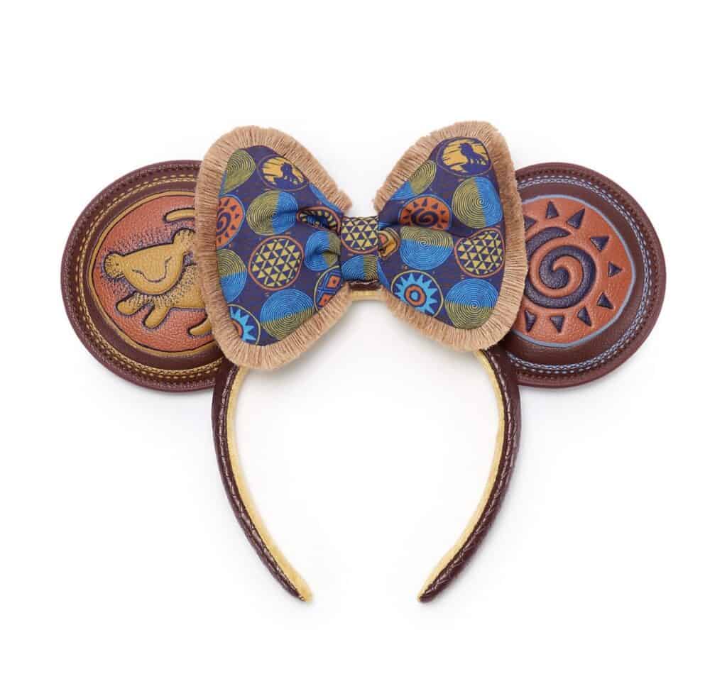 Minnie Mouse ears headband with chocolate cookie themed decorations and colorful bow.