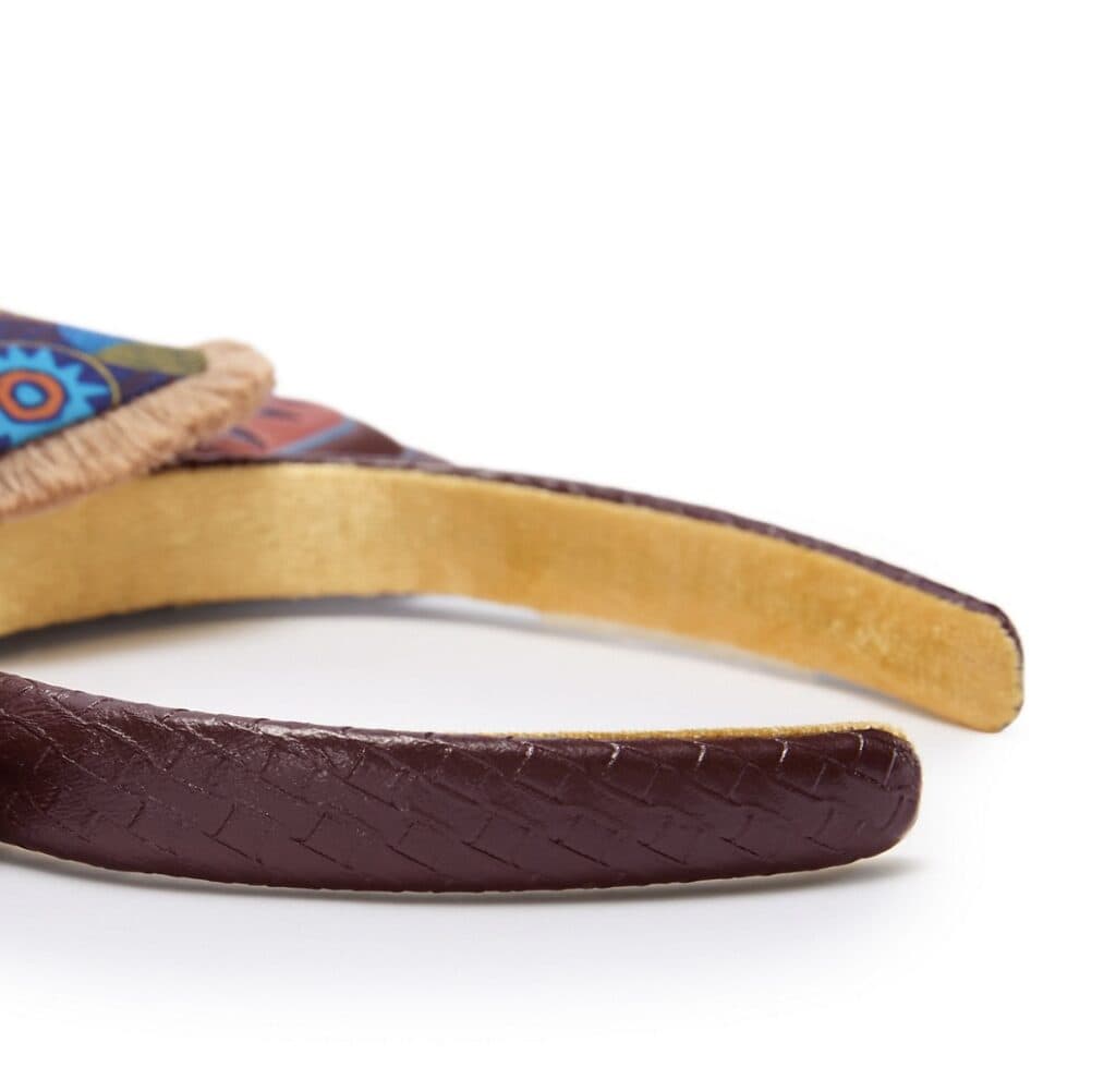 Headband with colorful Disney character design and textured fabric.