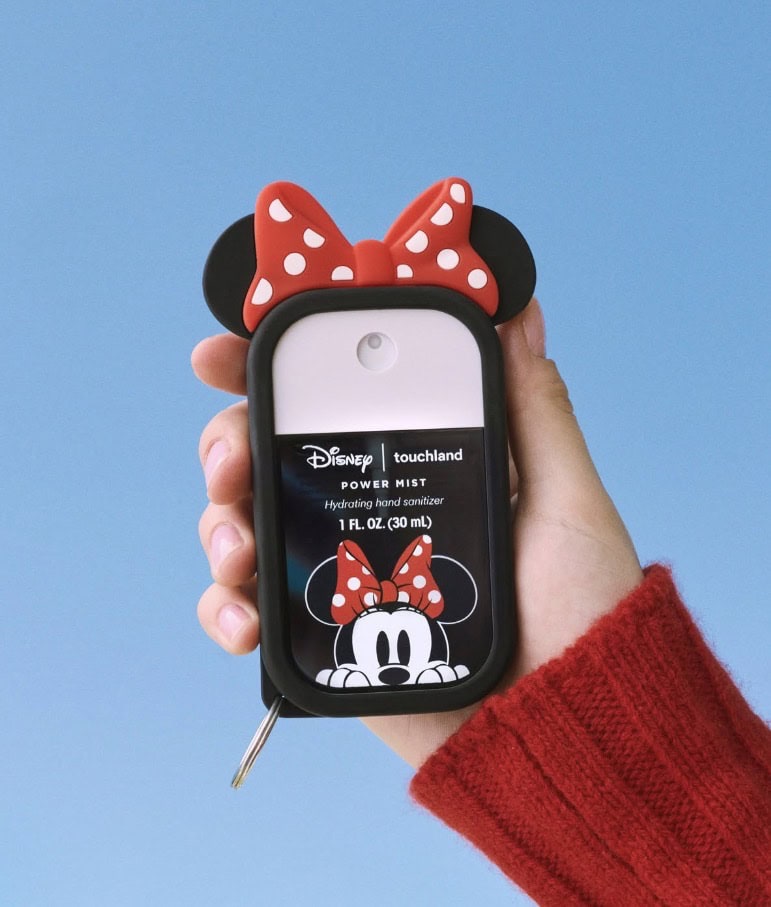 Minnie Mouse hand sanitizer holder with red polka dot bow, Disney character accessory.