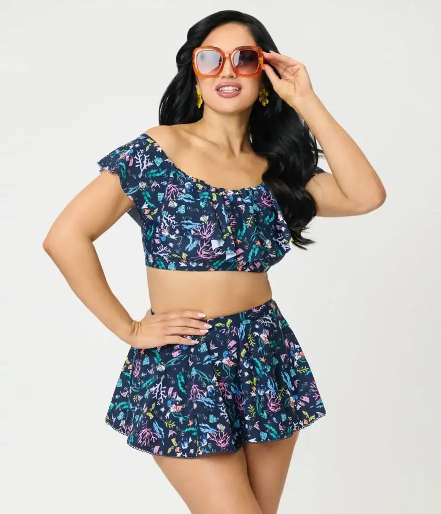 Woman in tropical Disney-themed summer outfit with sunglasses.