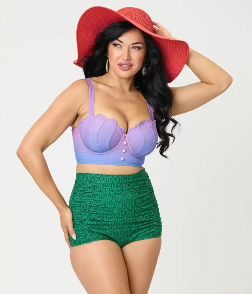 Disney fashionista in vibrant swimsuit and stylish red hat, showcasing summer Disney-inspired fashio.