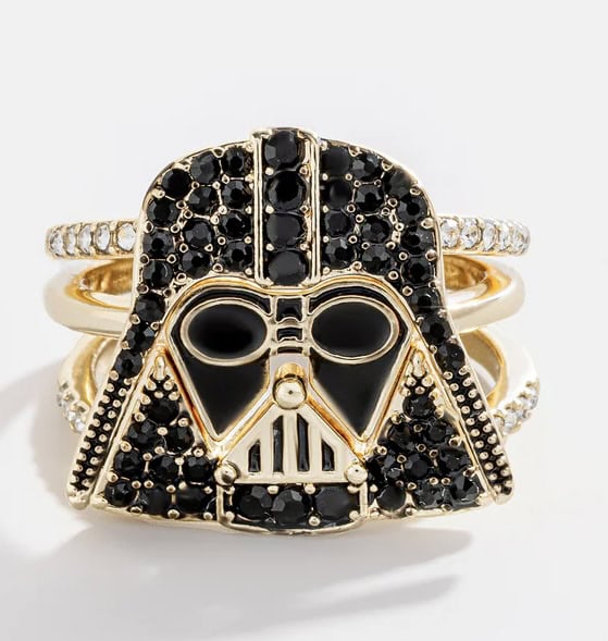 Gold and black Darth Vader face ring with gemstone accents.