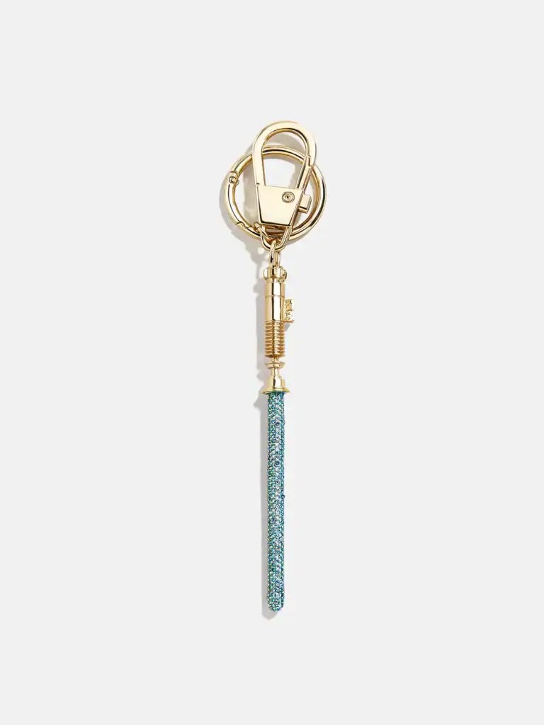 Keychain with sparkling blue strap and gold hardware, inspired by Disney fashion accessories.