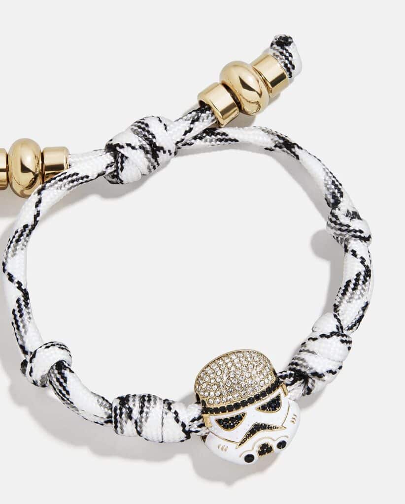 Bracelet with Star Wars-themed charms and black-and-white fabric band.