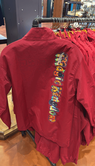 Red Disney jacket featuring colorful embroidered Disney logo on the back.