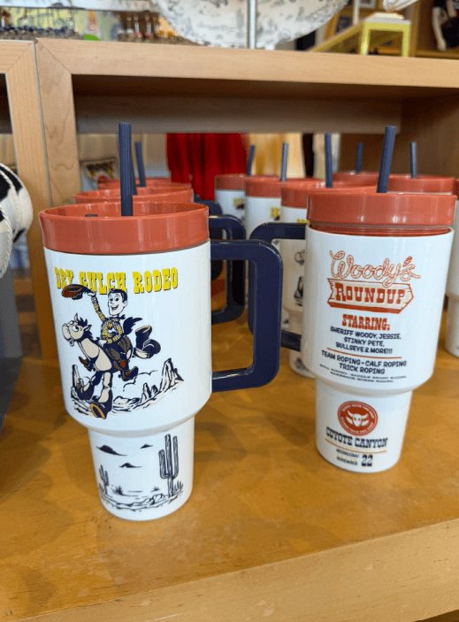 Disney vintage collectible mugs with desert and cowboy designs, perfect for Disney fans.