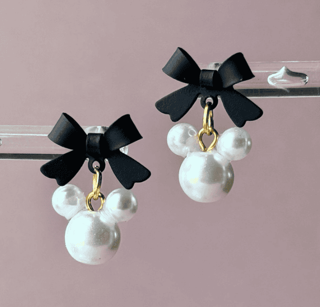 Pearl Mickey earrings with black bows, ideal Disney-themed jewelry for stylish accessories.