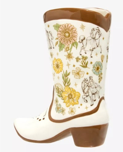 Decorative Disney-themed flower vase in the shape of a boot with floral and fairy tale motifs.