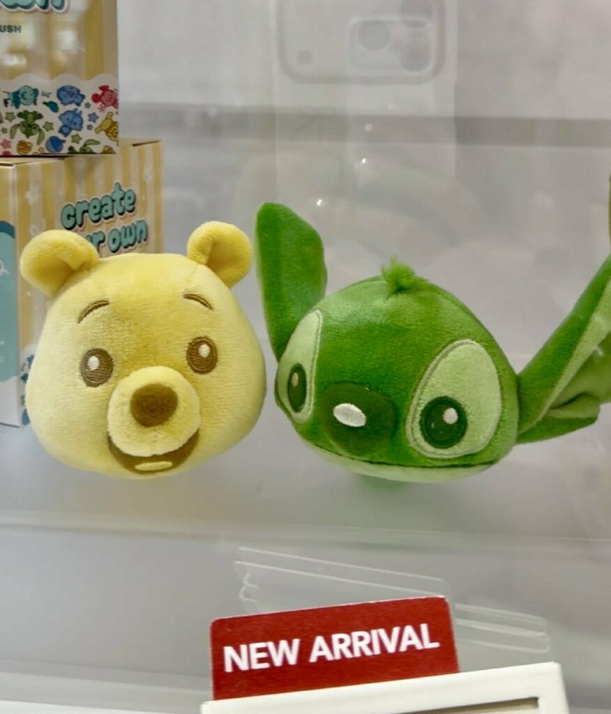 Adorable Winnie the Pooh and Baby Yoda plush toys for Disney fans and collectors.