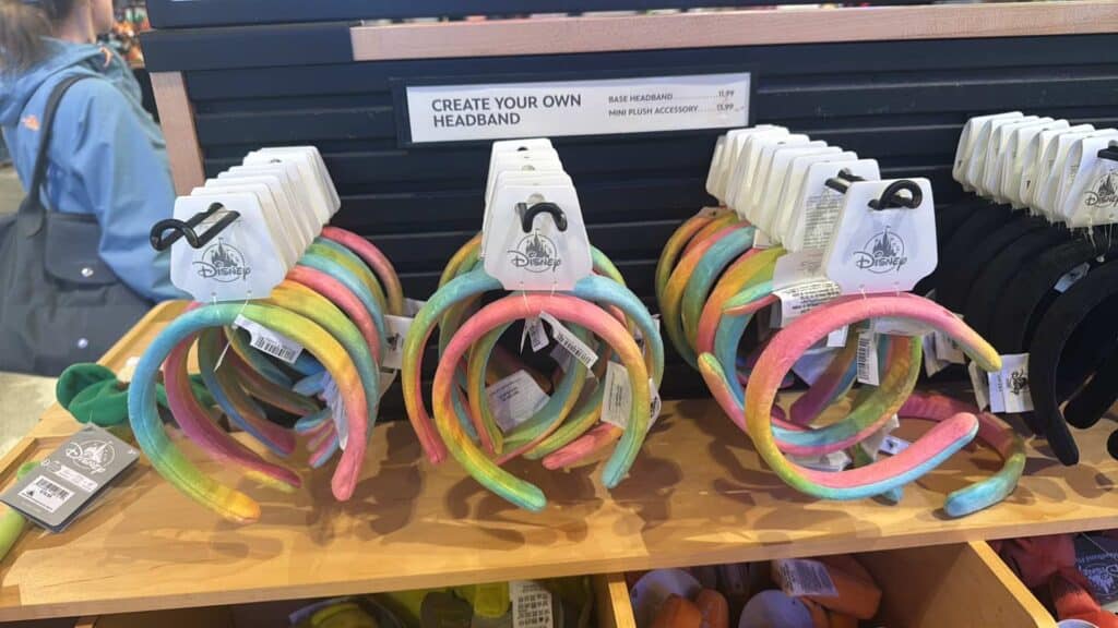 Colorful rainbow headbands for kids and adults, perfect for Disney-themed outfits and accessories.