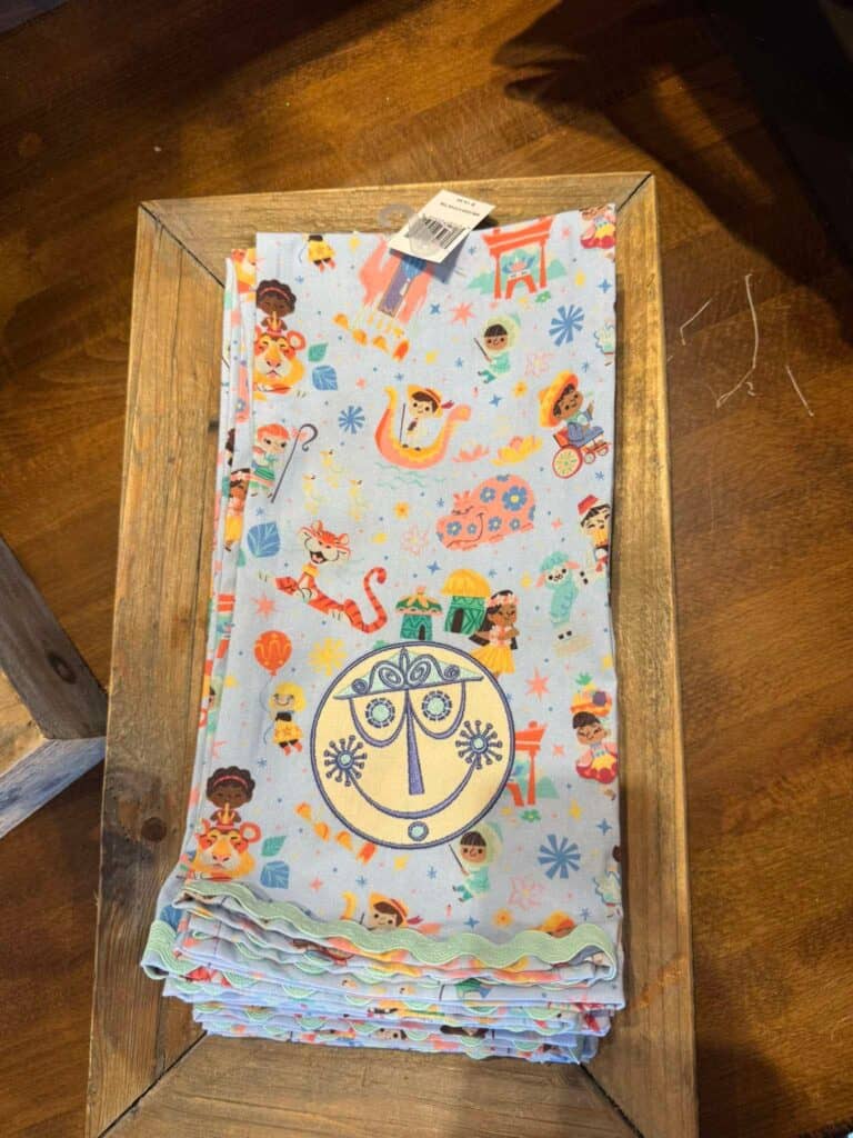 Mermaid-themed kids' towel with colorful Disney characters and ocean motifs. Perfect for beach or po.
