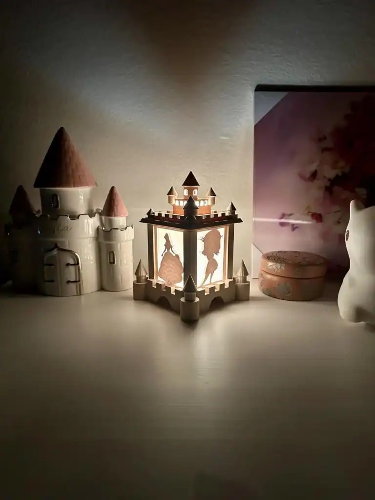 Decorative Disney-themed castle and figurine set for fans and collectors.