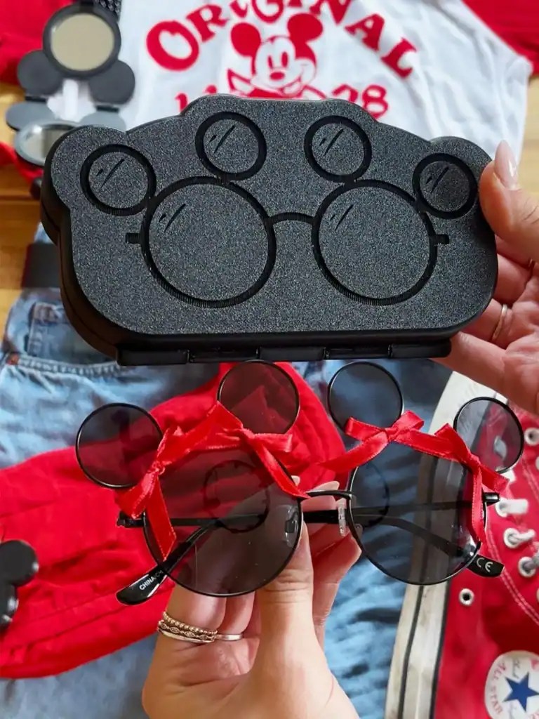 Mickey Mouse sunglasses with black lenses and red frame, perfect Disney fashion accessory.