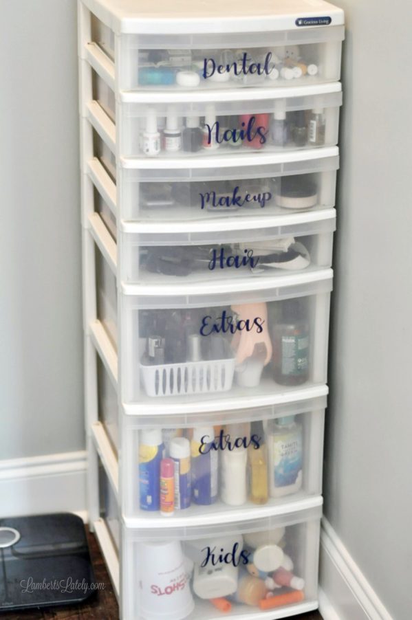 labeled plastic drawer system in a bathroom.