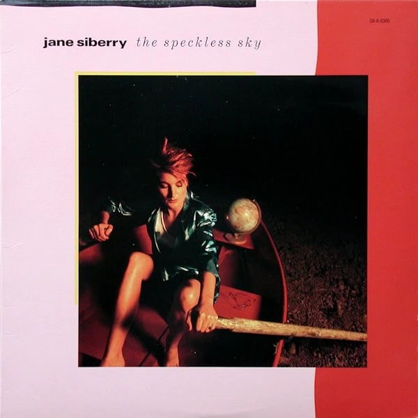 Album cover with Siberry rowing a boat on dry land.
