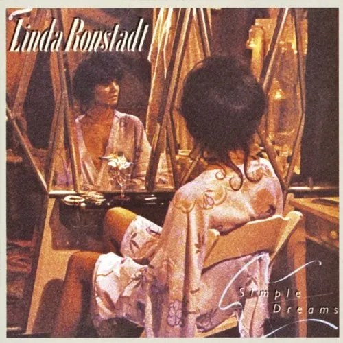 Linda Ronstadt sitting at a makeup  mirror.