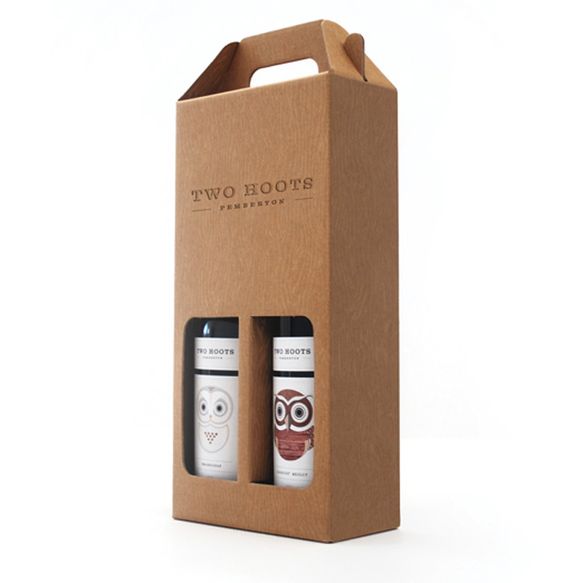 Eco-friendly wine bottle gift box with owl and owl face designs.