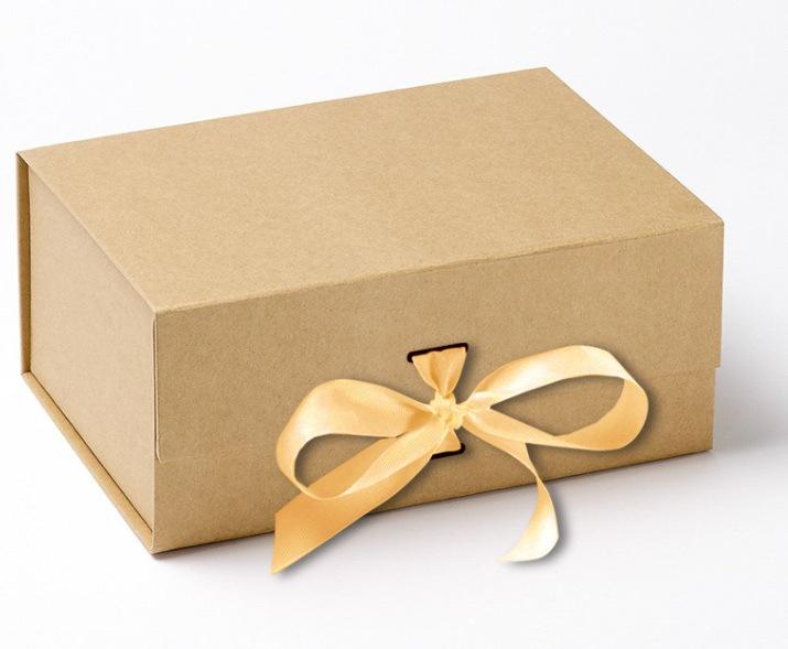 Brown gift box with a cream satin ribbon tied in a bow.